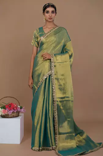 sea green handwoven tissue saree with scalloped lace