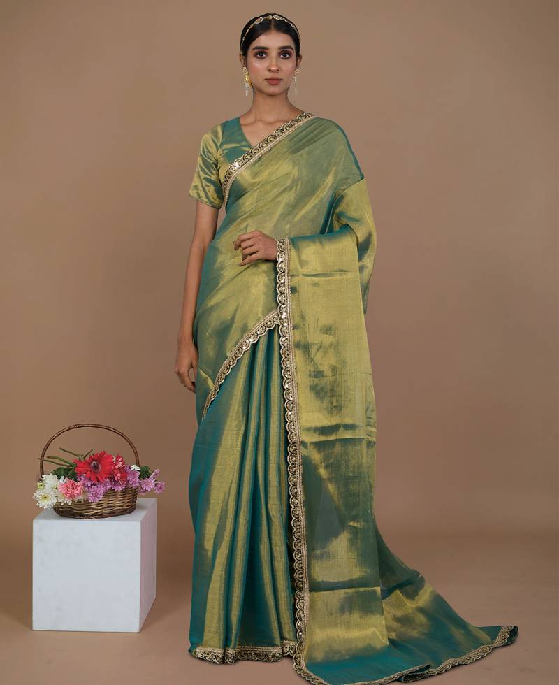 sea green handwoven tissue saree with scalloped lace