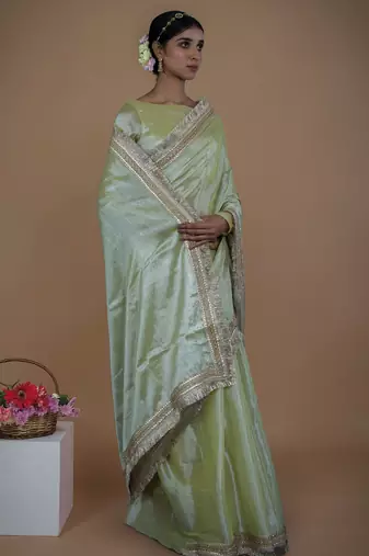 olive handwoven tissue saree with matte gold lace