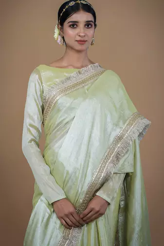 olive handwoven tissue saree with matte gold lace