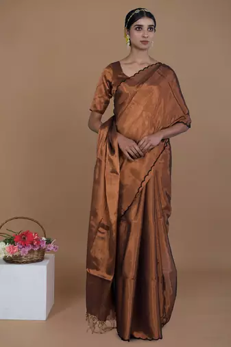 copper handwoven tissue saree with scalloped pallu and border