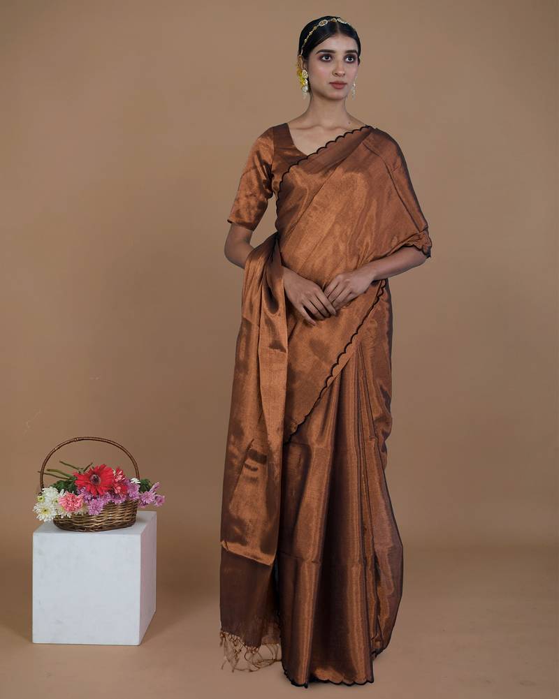 copper handwoven tissue saree with scalloped pallu and border