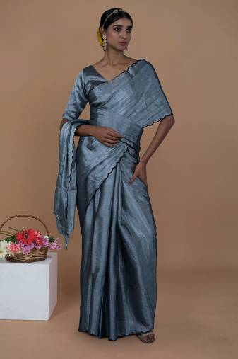 silver handwoven tissue saree with scalloped pallu and border