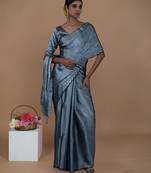 silver handwoven tissue saree with scalloped pallu and border