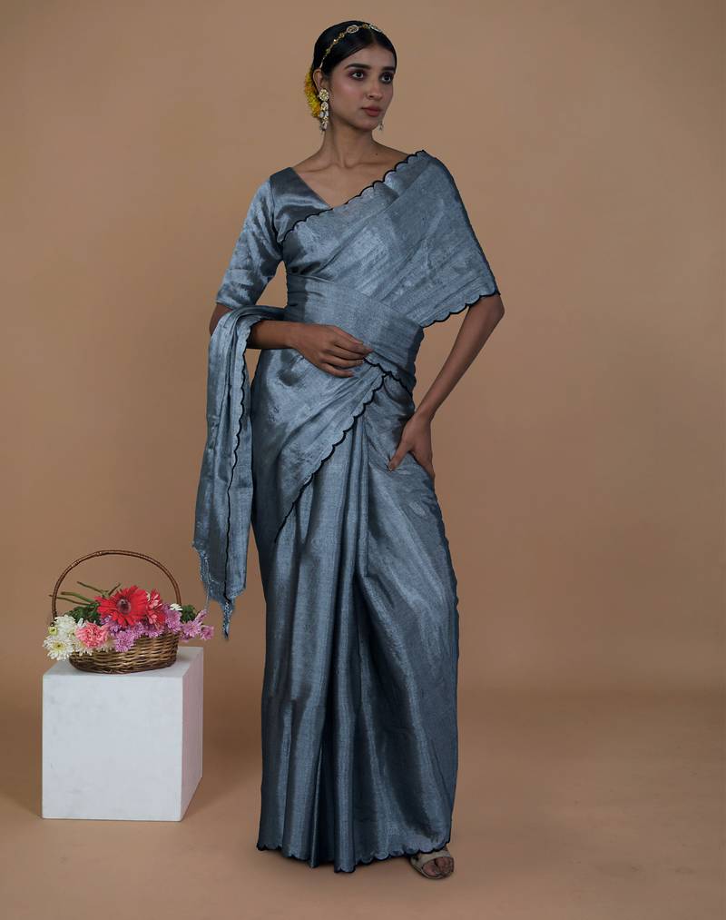 silver handwoven tissue saree with scalloped pallu and border