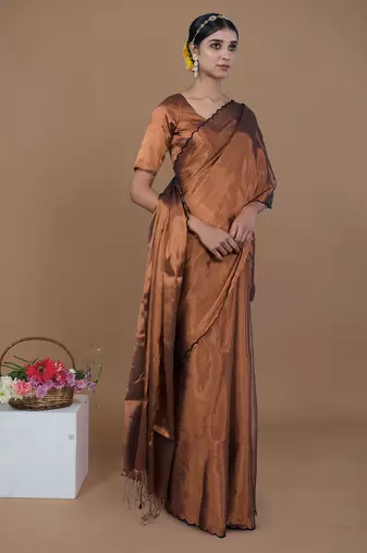copper handwoven tissue saree with scalloped pallu and border