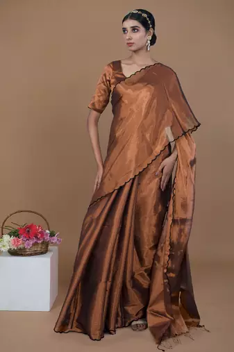 copper handwoven tissue saree with scalloped pallu and border
