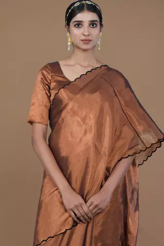 copper handwoven tissue saree with scalloped pallu and border