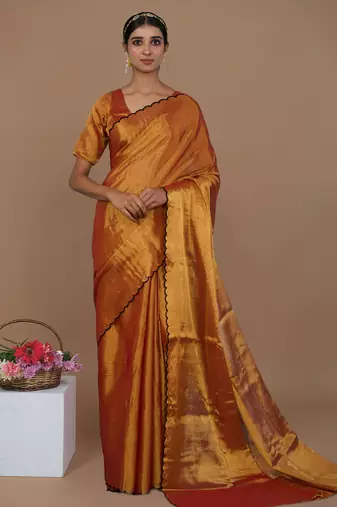 rust gold handwoven tissue saree with scalloped pallu and border