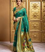 Green woven paithani silk blend saree with blouse