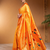 Orange paithani silk blend saree with zari detailing and blouse