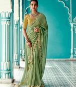 green embroidered saree with jacquard work blouse piece