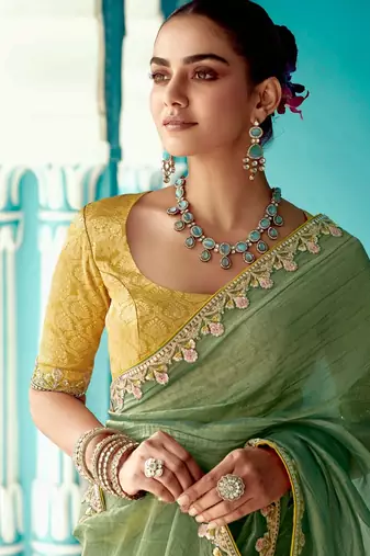 green embroidered saree with jacquard work blouse piece