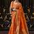 orange silk blend tissue zari weaving saree with blouse piece
