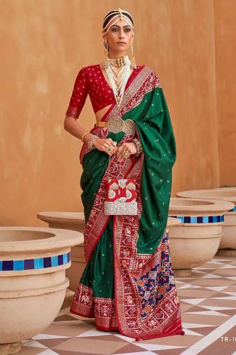 dark green silk blend zari weaving and patola border saree with blouse piece