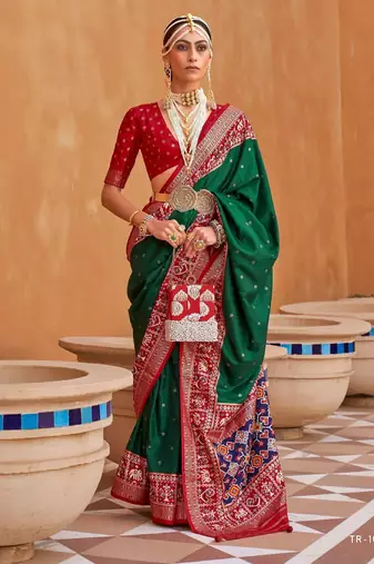 dark green silk blend zari weaving and patola border saree with blouse piece