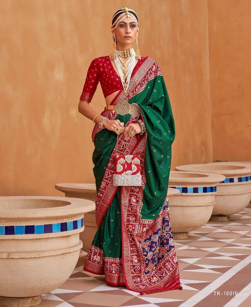 dark green silk blend zari weaving and patola border saree with blouse piece
