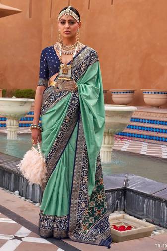 sea green silk blend zari weaving and patola border saree with blouse piece
