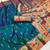 Teal blue silk blend saree with paithani weaved pallu and blouse