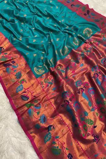 Sky blue banarasi silk blend saree with paithani weaved pallu and blouse