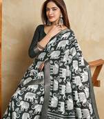 green silk blend elephant print saree with jacquard zari border