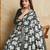 green silk blend elephant print saree with jacquard zari border