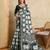 green silk blend elephant print saree with jacquard zari border