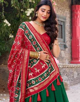 Green and Red Patola-Inspired Lehenga Choli. 2