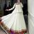 Elegant White Lehenga Choli with Vibrant Patchwork Border