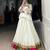 Elegant White Lehenga Choli with Vibrant Patchwork Border
