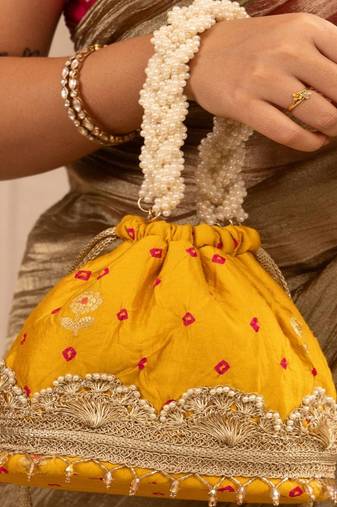 Yellow silk embroidered potli bag