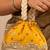 Yellow silk embroidered potli bag