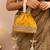 Yellow silk embroidered potli bag