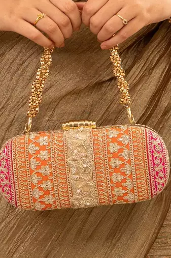 Orange silk embroidered clutch