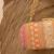 Orange silk embroidered clutch
