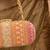 Orange silk embroidered clutch