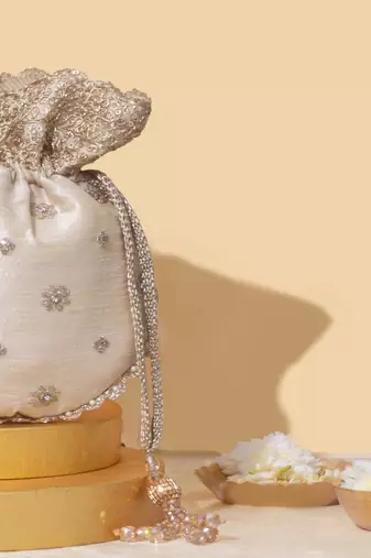 Beige silk embroidered potli bag