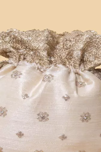 Beige silk embroidered potli bag