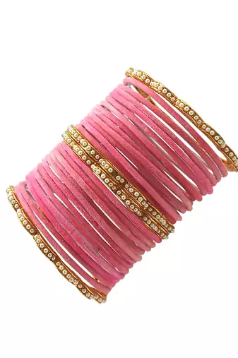 Set of 28 gold, pink velvet with metal bangle set