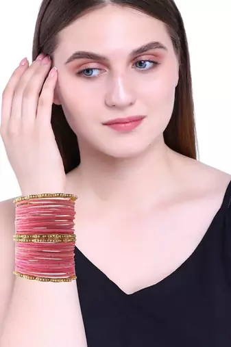 Set of 28 gold, pink velvet with metal bangle set