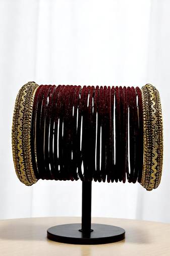 Set of 26 maroon and gold plated velvet bangle set