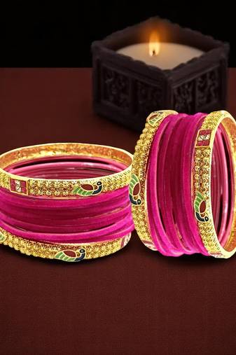 Set of 28 rani and gold plated velvet bangle set