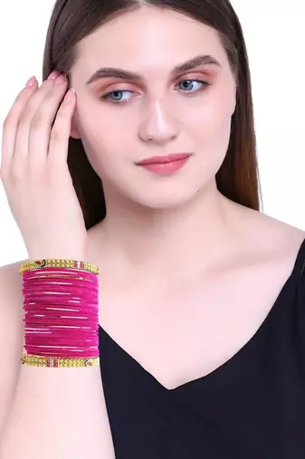 Set of 28 rani and gold plated velvet bangle set