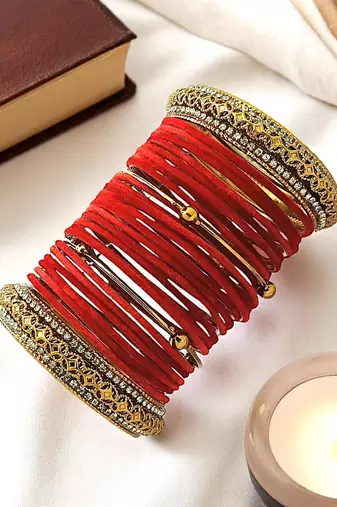 Set of 28 red and gold plated velvet bangle set