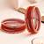Set of 12 red, peach glass with velvet bangle set