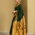 Green traditional paithani silk saree with rich zari weaving and contrast border – perfect for wedding wear