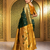 Green traditional paithani silk saree with rich zari weaving and contrast border – perfect for wedding wear