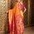 Orange traditional paithani silk saree with rich zari weaving and contrast border – perfect for wedding wear