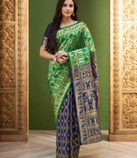 Green paithani silk blend saree with intricate weaving and blouse piece