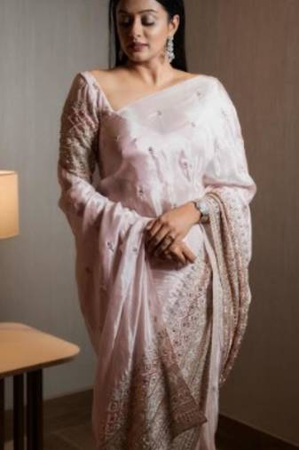 Cream pure tissue silk heavy thread embroidery work on border with zari weaving saree with blouse